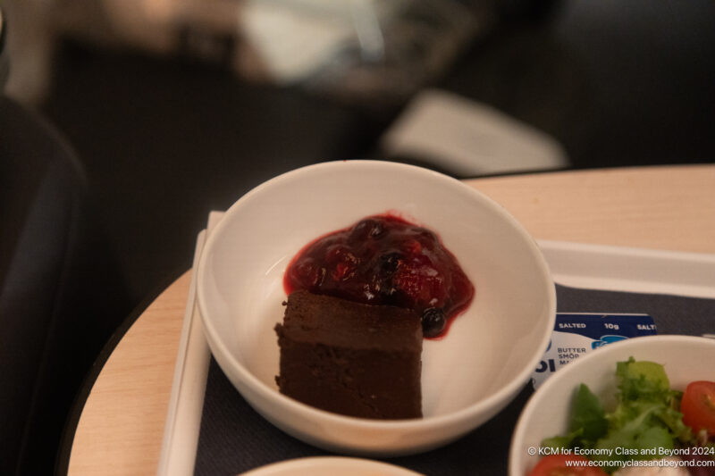 a brownie in a bowl with jam