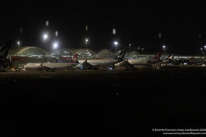 airplanes at an airport at night