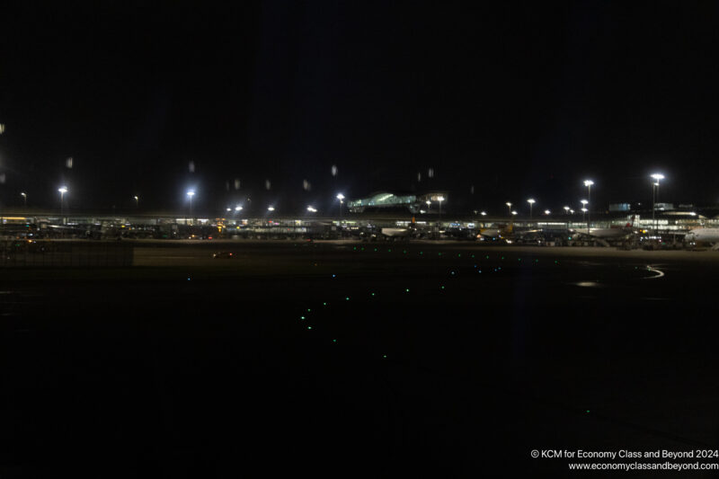 a runway at night with lights