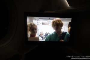 a screen with a woman and a man in a hospital