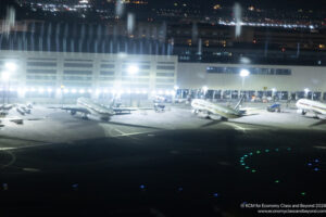 airplanes at an airport at night