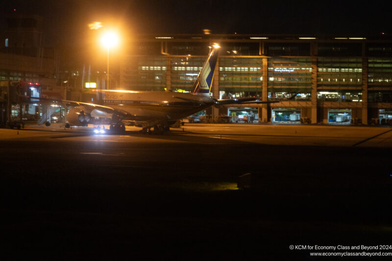 an airplane on the runway at night