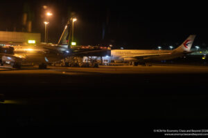 an airplane at a terminal at night