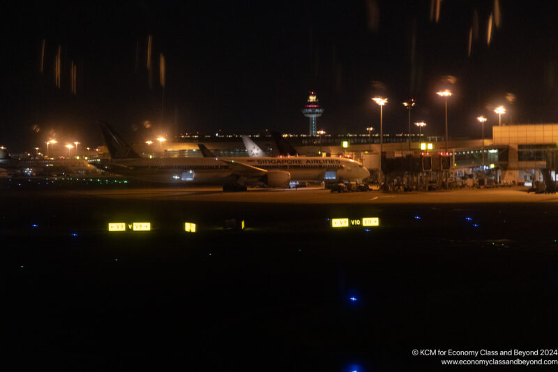 an airplane on the runway at night