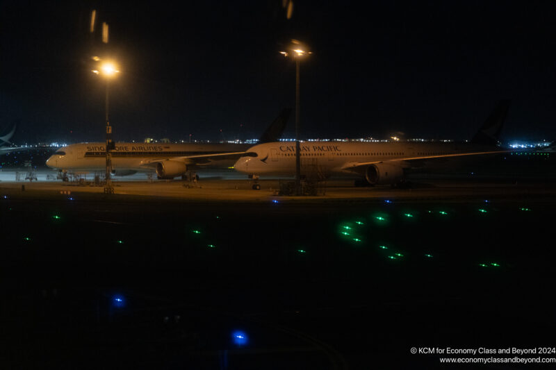 an airplane on the runway at night