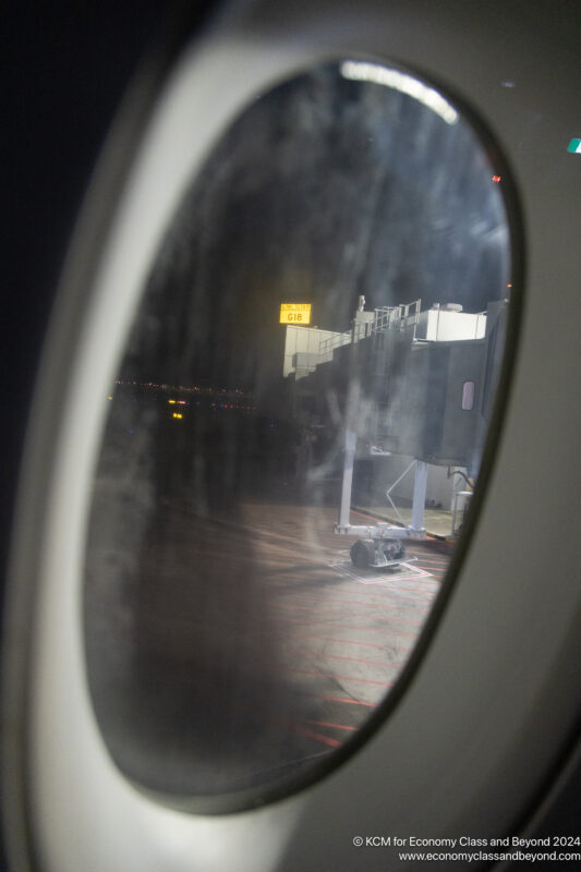 a window of an airplane at night