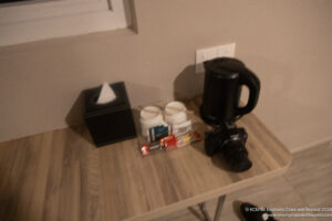 a camera and coffee on a table