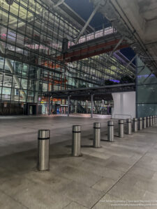 a building with glass walls and a walkway