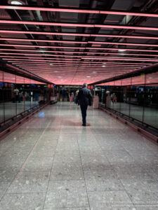 a man walking in a hallway