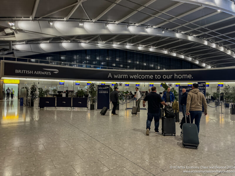 people in an airport with luggage