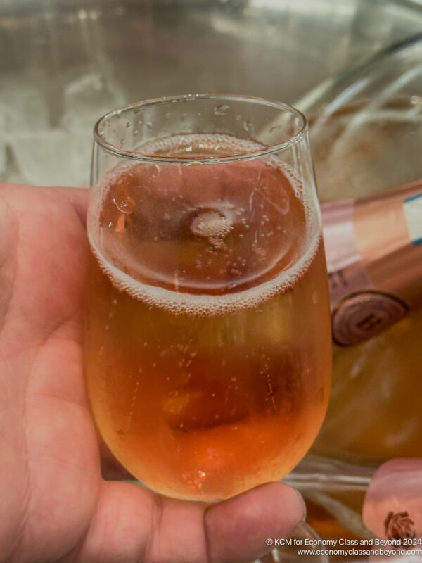 a hand holding a glass of beer