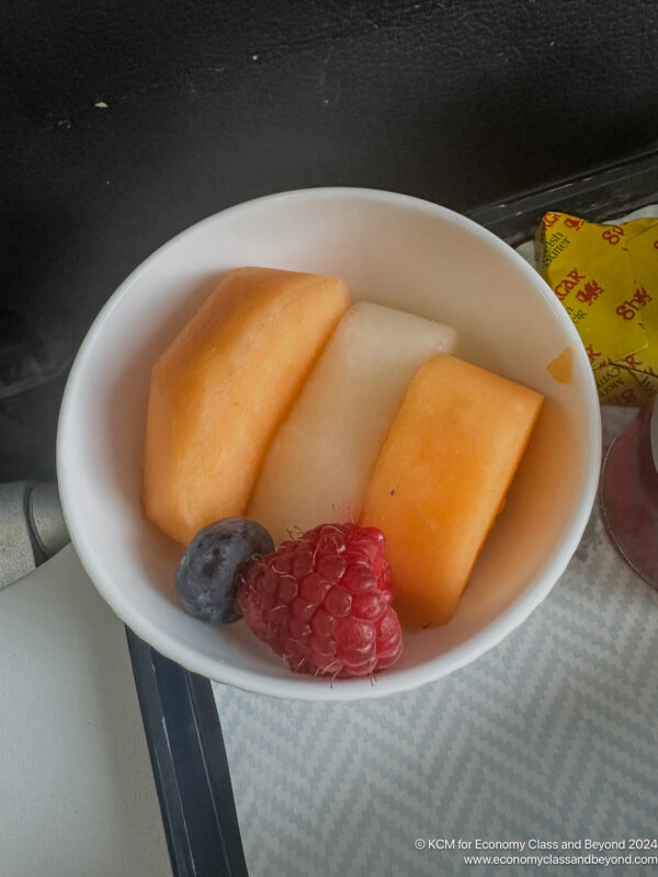 a bowl of fruit and berries