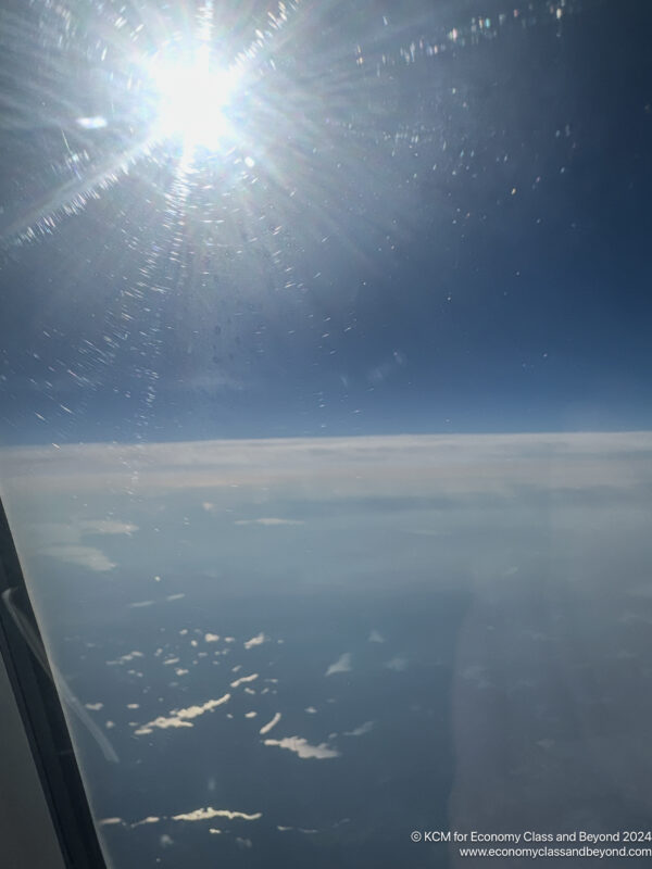 a view of the sun from an airplane window