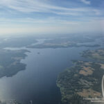 aerial view of a body of water and land from an airplane