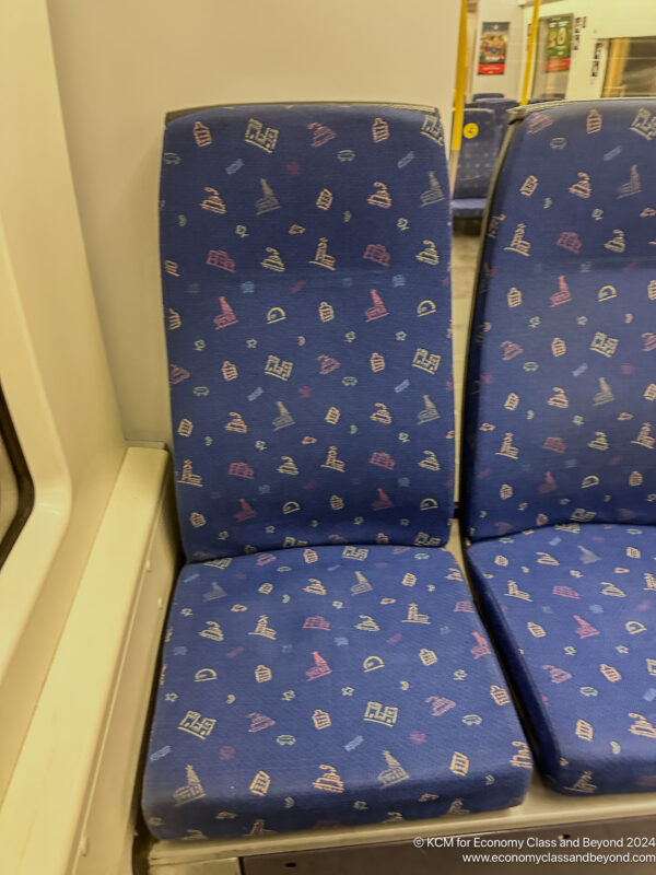 a blue seats with a pattern on it