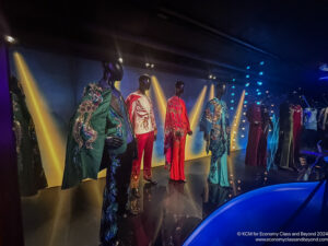 a group of mannequins in a room with lights