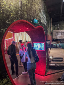 a group of people standing in front of a screen