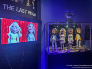 a group of puppets in a glass case