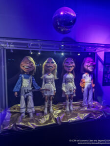 a group of puppets in a glass case