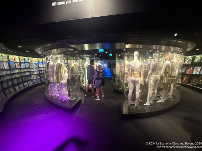 a group of people looking at a display case