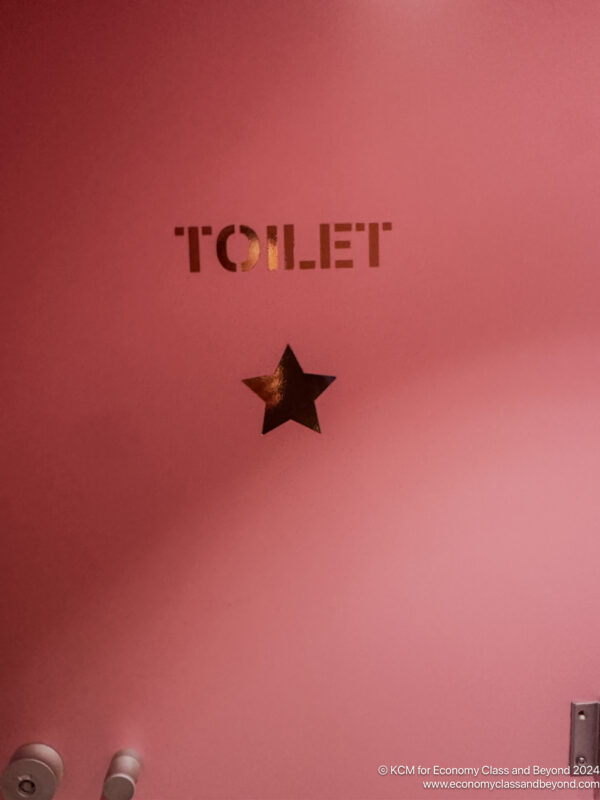 a pink sign with a star on it