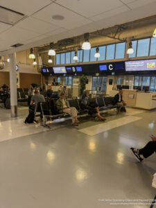 people sitting on benches in a terminal