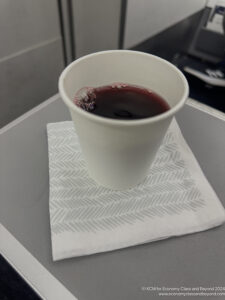 a cup of liquid on a napkin