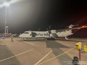 a plane on the runway at night