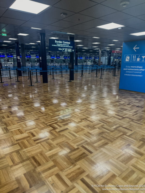 a wooden floor with blue lines and signs