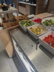 a group of bowls of food on a counter