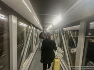 a group of people walking down a walkway