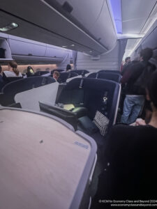 a group of people sitting in an airplane