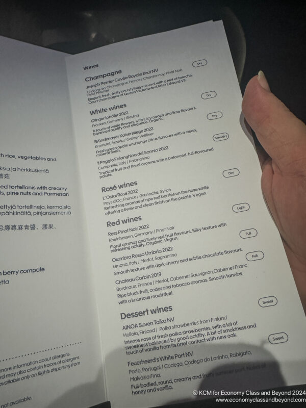 a hand holding a menu