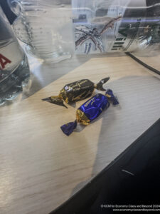 two wrapped candy on a table