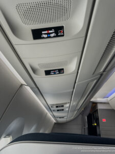 a ceiling with signs and lights