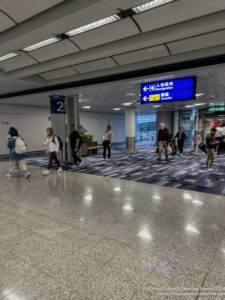 a group of people walking in a large hall
