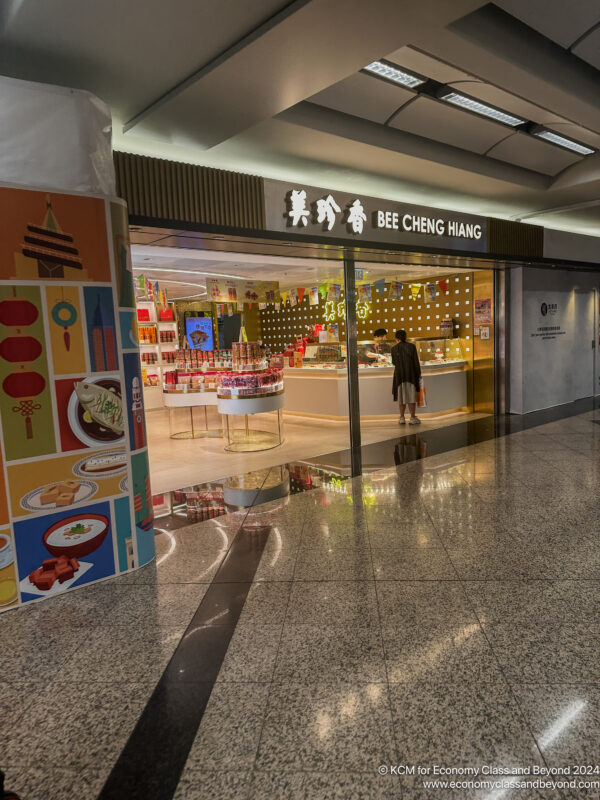 a storefront with people walking in the front