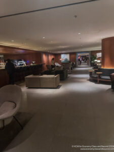a room with a bar and chairs