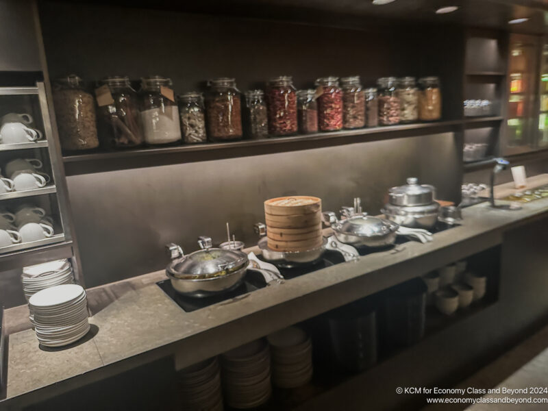 a kitchen with food on a shelf