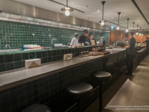 a group of people standing behind a counter