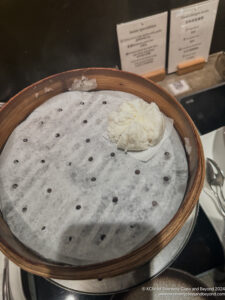 a bowl of food with a piece of food on it