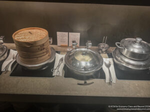 a group of metal pots and bowls on a counter