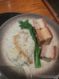 a plate of food with meat and rice