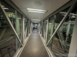 a long hallway with glass windows