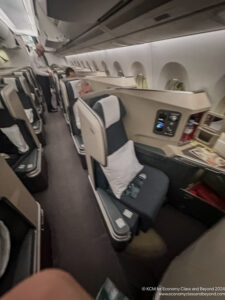 a group of people sitting in an airplane