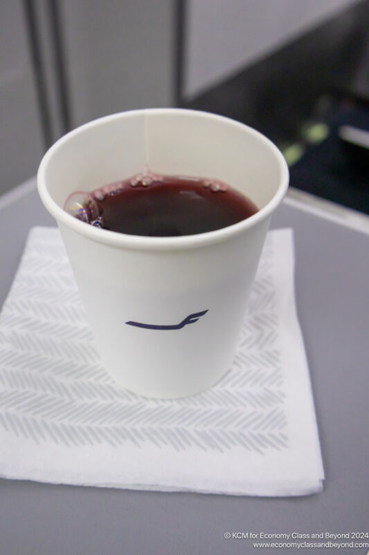 a cup of liquid on a napkin