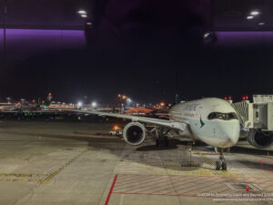 an airplane on the tarmac at night