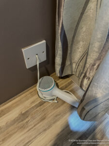 a hair dryer plugged into a wall