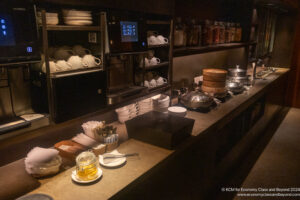 a counter with a variety of dishes and utensils