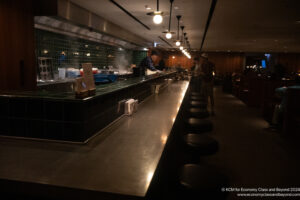 a group of people standing at a counter